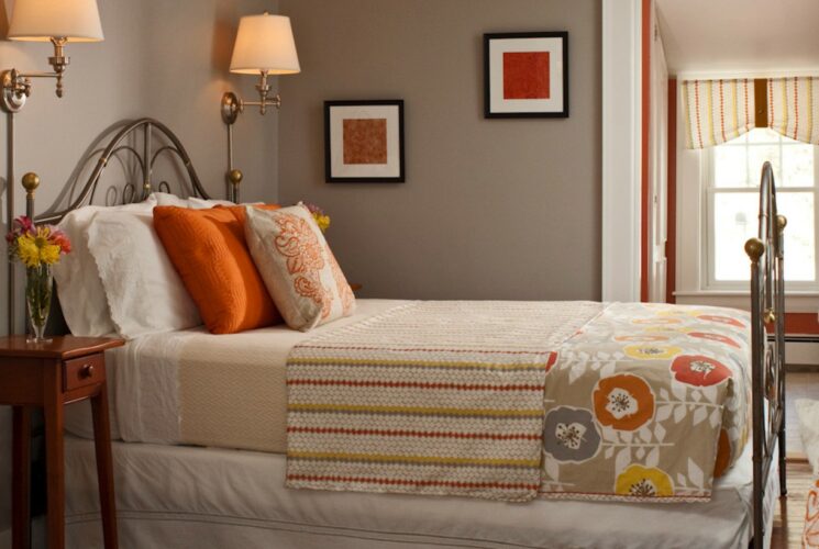 beige striped bedspread with flowers