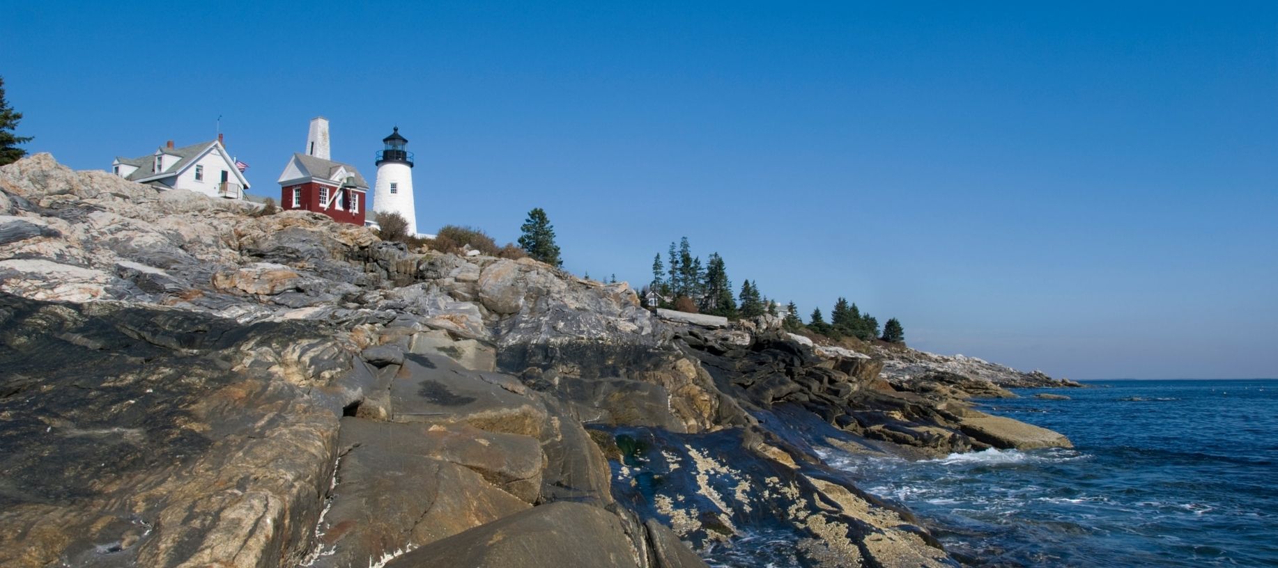 Rocky boulders lining the coast of Maine