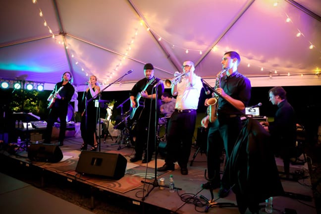 blues band on stage under lights