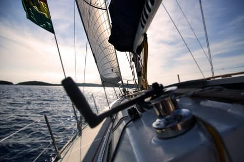 sails and winch on sailboat on the water