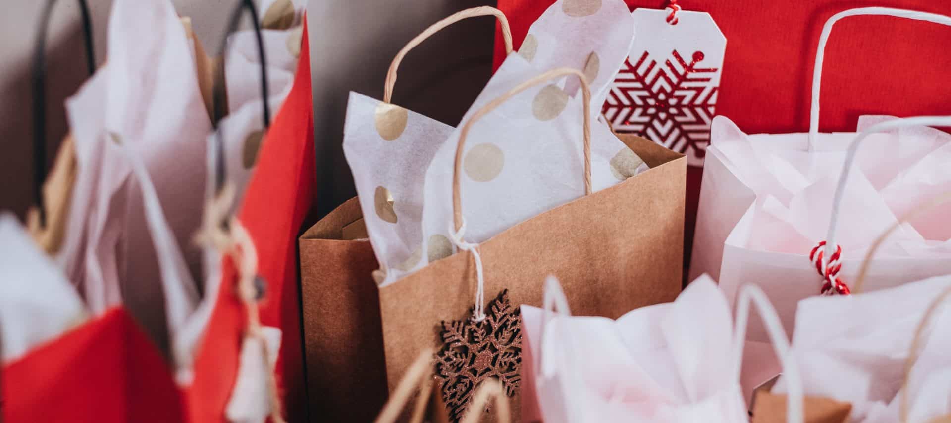 Several holiday shopping bags