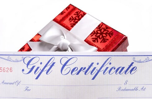 Red gift box fronted with Gift Certificates in an ornate font.